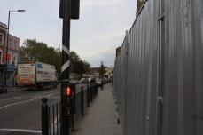 Barrier hiding construction on southside of Hackney Road.